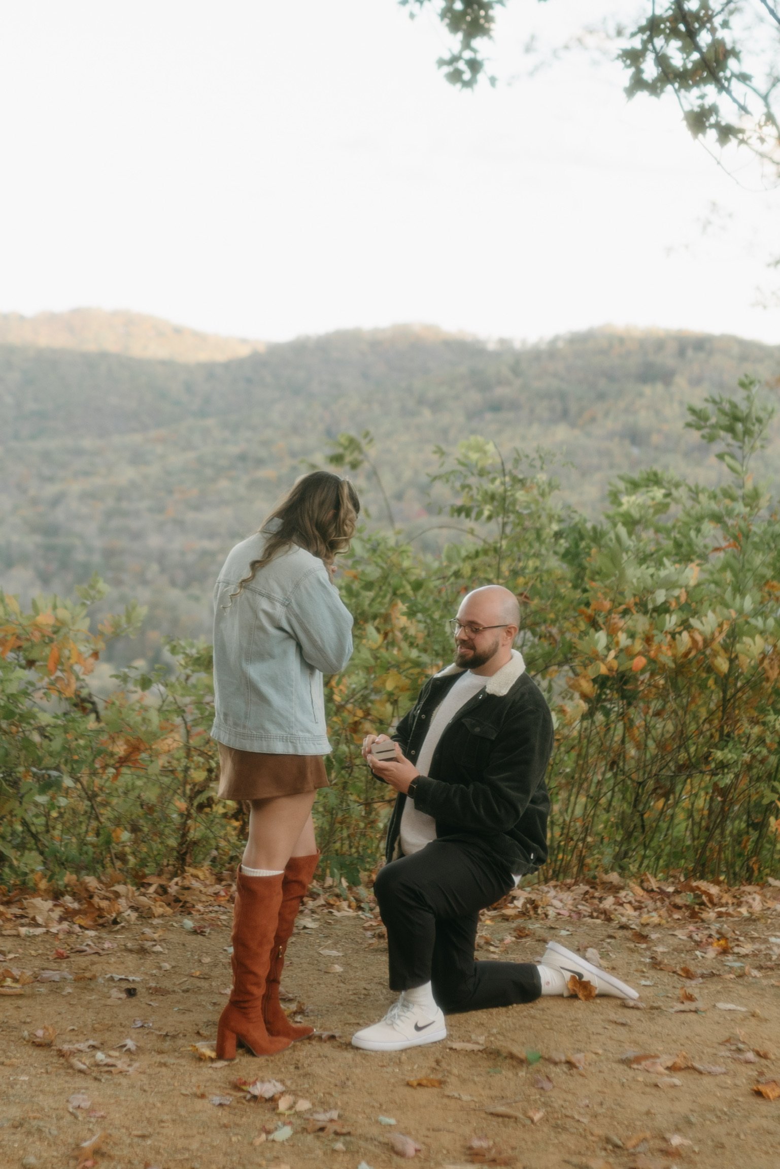 Closer: Nicole’s hand to her face as Ian kneels and holds up the ring.